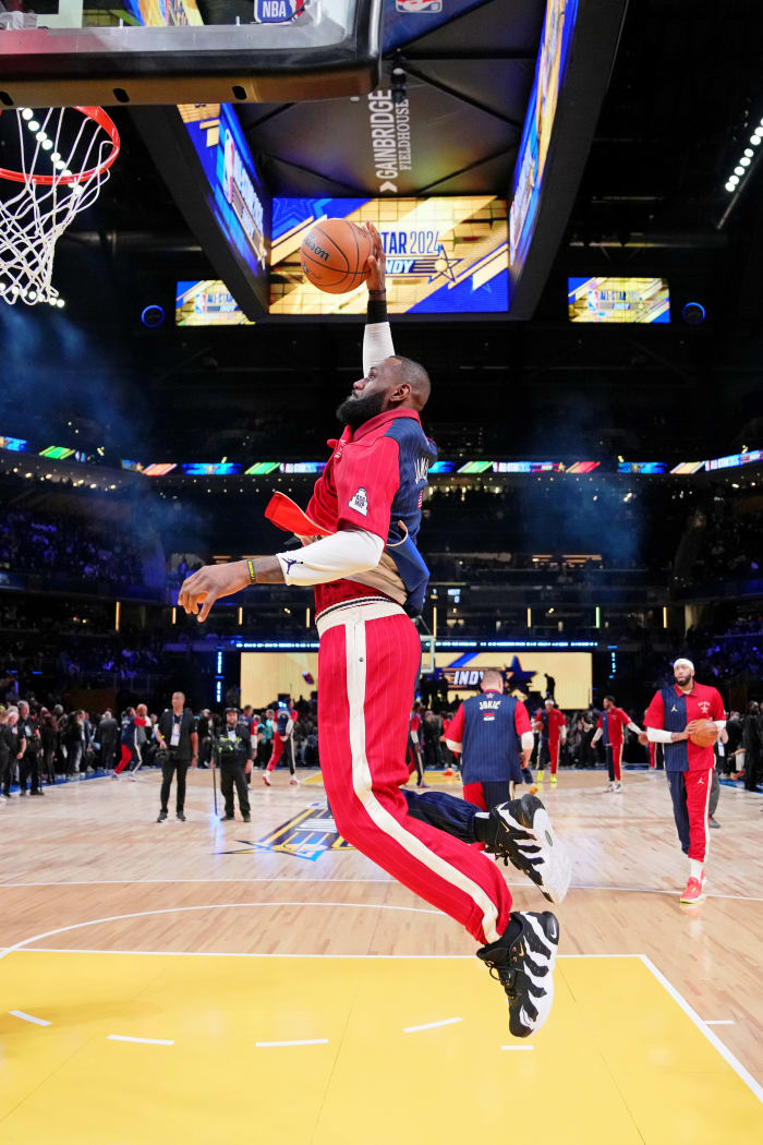 LeBron James dunks during warms up before the 2024 NBA All-Star game.